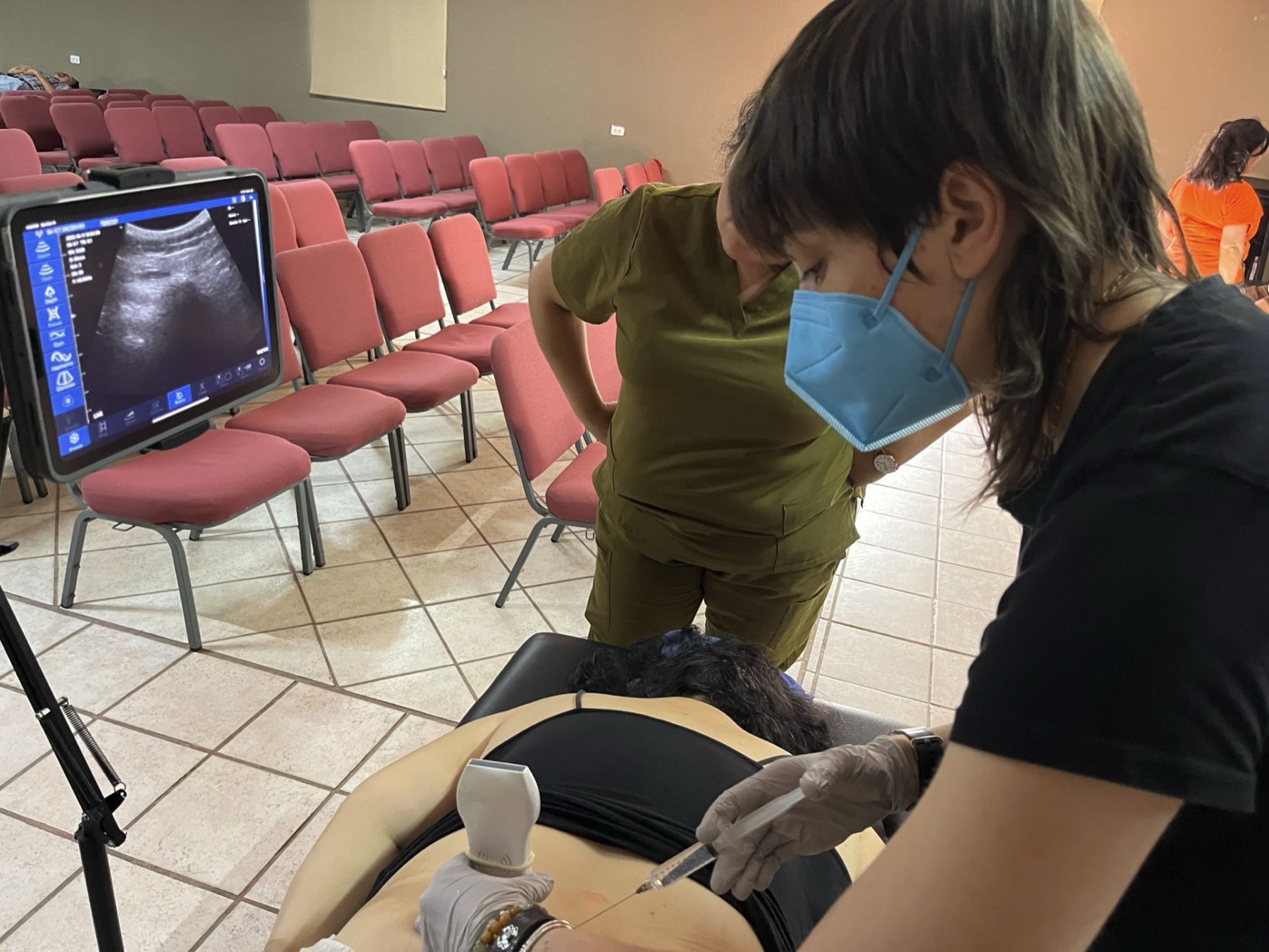 Dr. Annie supervising an ultrasound-guided injection